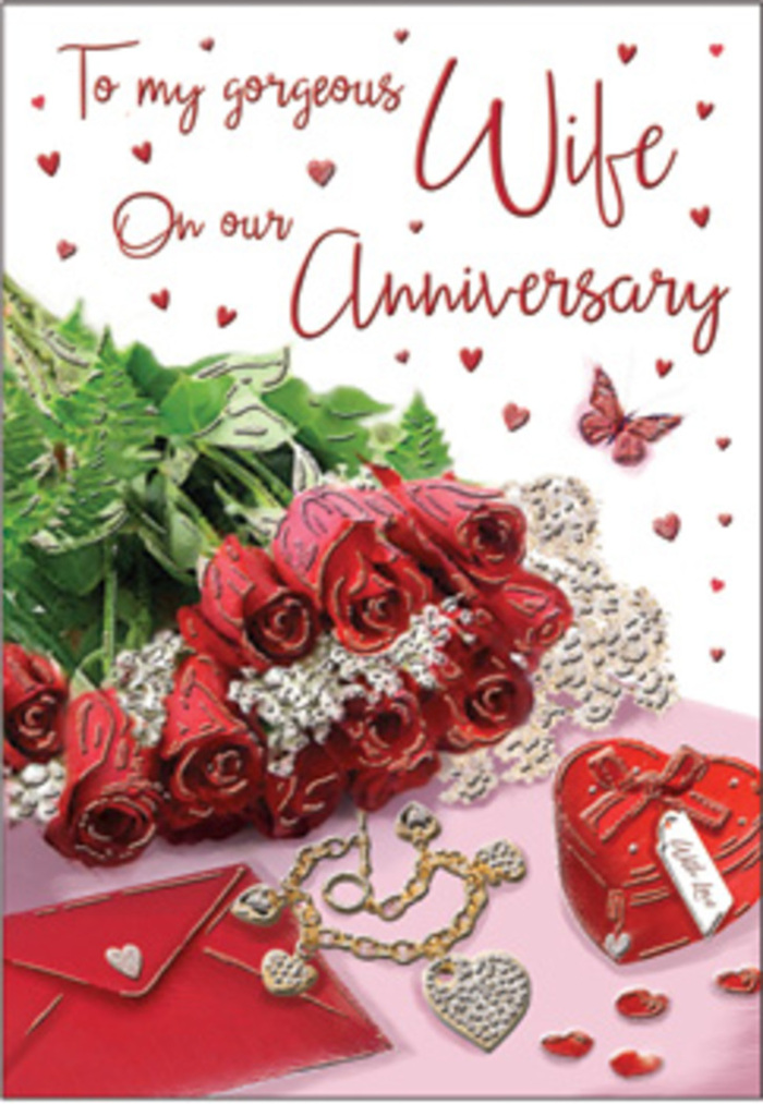 This anniversary card design unfolds as an intimate visual story, much like stepping into a softly lit Bickley home where a celebration has been thoughtfully prepared. At the centre, a compact but opulent group of crimson roses commands attention. The blooms are full and rounded, with densely packed petals that open in graceful spirals, their velvety surfaces catching the light with a muted sheen. Between the roses, wisps of greenery and fern-like fronds lend movement and contrast, balancing the intense reds with fresh, natural tones. Resting alongside the flowers is a rich red jewellery box, its lid slightly ajar and secured with a neat ribbon, suggesting a surprise gift waiting to be discovered. A golden necklace, delicately shaped into intertwined hearts, lies draped across the card or tabletop, its polished surface reflecting warm highlights. Scattered around are sparkling decorations-tiny hearts and jewel-like accents-that create a celebratory shimmer, as if the light from a nearby lamp near Bickley's residential streets were dancing across the scene. The anniversary card itself, adorned with flowing, romantic text, appears nestled among these treasures, the script surrounded by cascades of illustrated hearts that echo the theme of devotion. The overall lighting is gentle and flattering, casting soft shadows that emphasize the layered textures of petals, paper, metal, and ribbon. The image conveys not just a gift, but a moment: the quiet anticipation before the card is handed over, the shared smile when the jewellery is revealed, and the sense that this anniversary, like the roses, is both timeless and freshly alive with love.